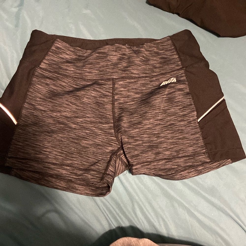 Grey tight fit workout shorts with small pockets in the side